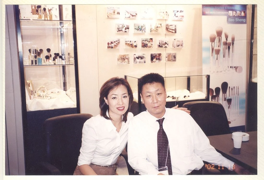 J.W. Lee and Saehee Lee, husband and wife, on the Baosheng stand at Cosmoprof Asia, Hong Kong, November 2002